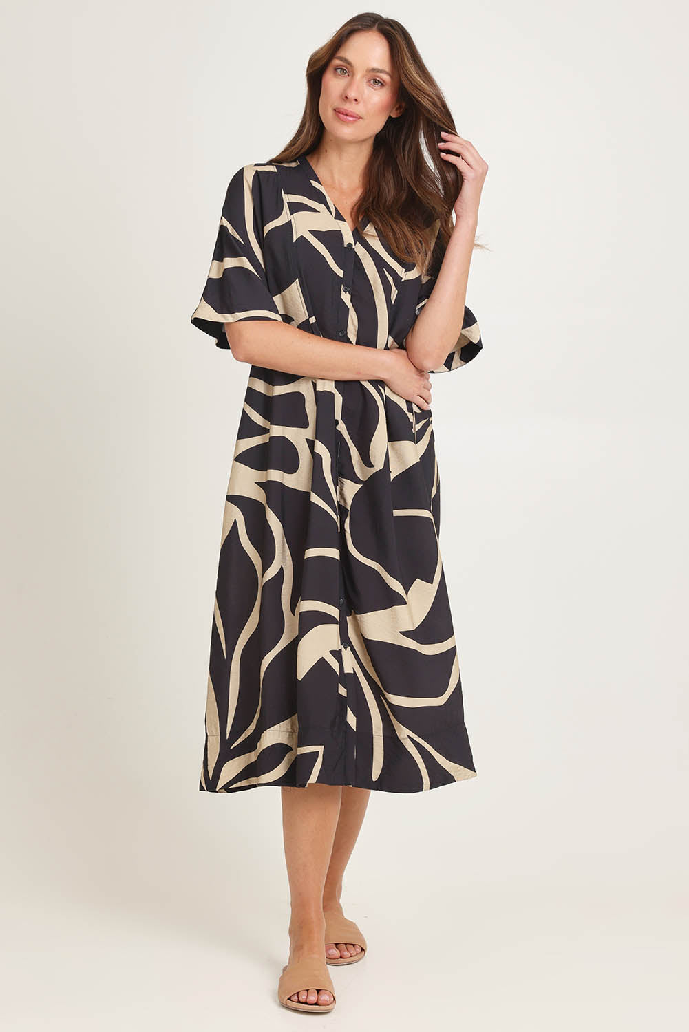 Model Madeline wearing size 10 of the Camille Dress in colour Floral (Black), from the front, showing the whole outfit