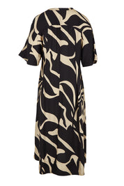Product shot of the Camille Dress in colour Floral (Black), from the back