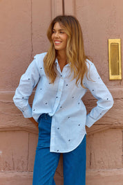 A model wearing the Reid Cotton Blend Shirt in colour Bowstripe (Blue), from the front, showing the whole outfit