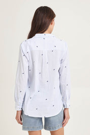 Model Madeline wearing size 10 of the Reid Cotton Blend Shirt in colour Bowstripe (Blue), from the back