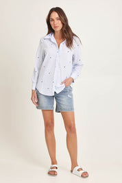 Model Madeline wearing size 10 of the Reid Cotton Blend Shirt in colour Bowstripe (Blue), from the front, showing the whole outfit