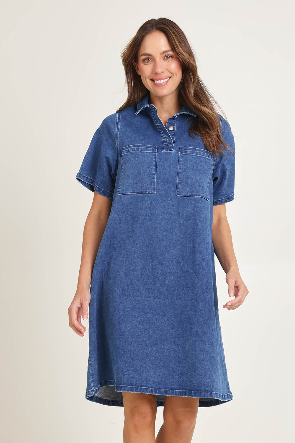 Model Amanda wearing size 16 of the Shift Denim Shirt Dress in colour Dustyblue (Blue), from the front, cropped image
