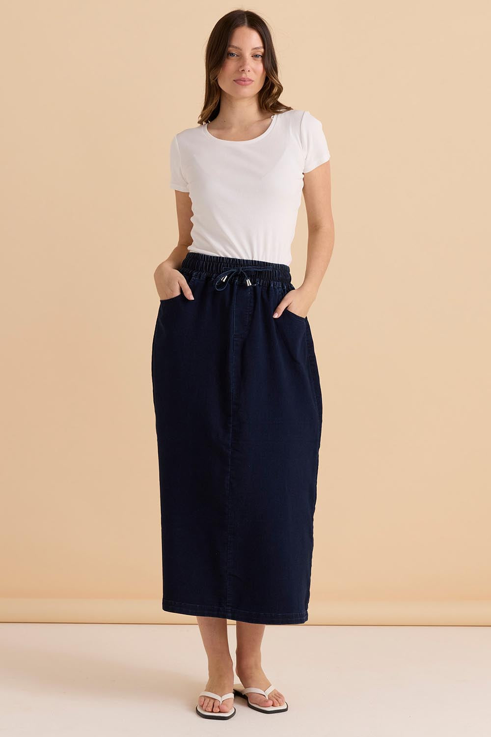 A model wearing the Denim Maxi Jogger Skirt in colour Darkblue (Blue), from the front, showing the whole outfit