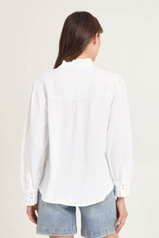 Model Madeline wearing size 10 of the Lucille Lyocell Pleated Shirt in colour White (White), from the back