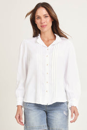Model Madeline wearing size 10 of the Lucille Lyocell Pleated Shirt in colour White (White), from the front, cropped image