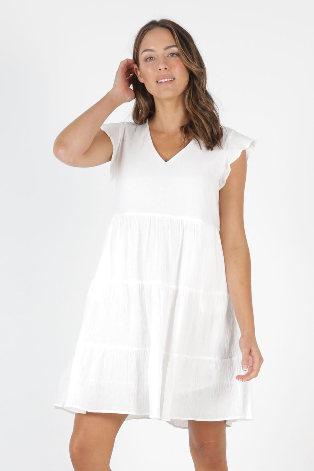Model Madeline wearing size 10 of the Skyler Dress in colour White (White), from the front, cropped image