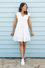Model Madeline wearing size 10 of the Skyler Dress in colour White (White), from the front, showing the whole outfit