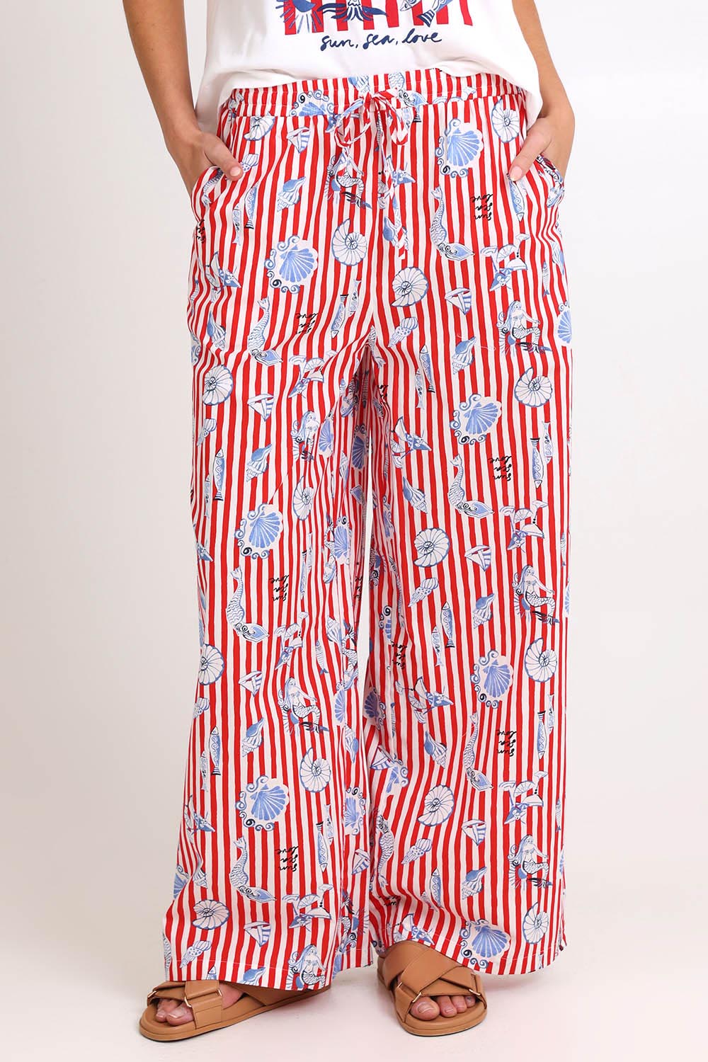 Model Madelinec wearing size 10 of the Amalfi Pant – Amalfi in colour Amalfi, in a cropped view