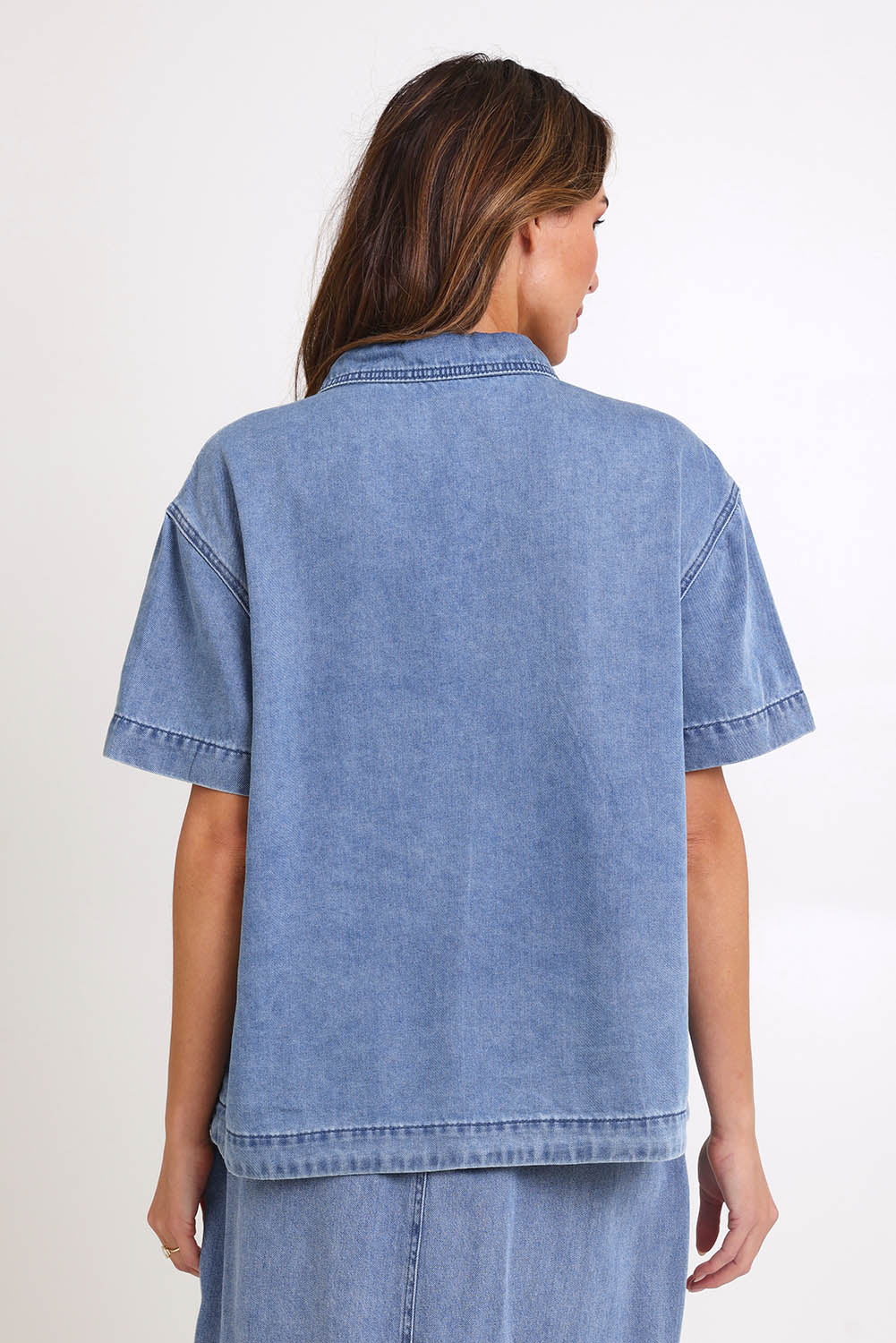 Model Madelinec wearing size 10 of the Quinn Cotton Shirt – Bluemed in colour Bluemed, from the back
