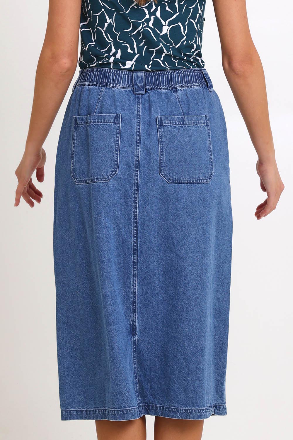 Model Madelinec wearing size 10 of the Solange Midi Denim Skirt – Medwash in colour Medwash, from the back