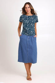 Model Madelinec wearing size 10 of the Solange Midi Denim Skirt – Medwash in colour Medwash, from the front