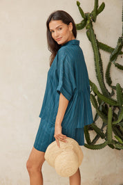 Model Genericm wearing size sample of the Ophelia Shirt – Teal in colour Teal, from an angle