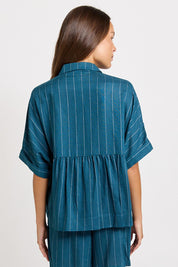 Model Genericm wearing size sample of the Ophelia Shirt – Teal in colour Teal, from the back