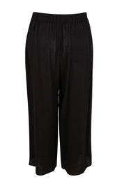 Product shot of the Bella Crop Pants – Black in colour Black, from the back