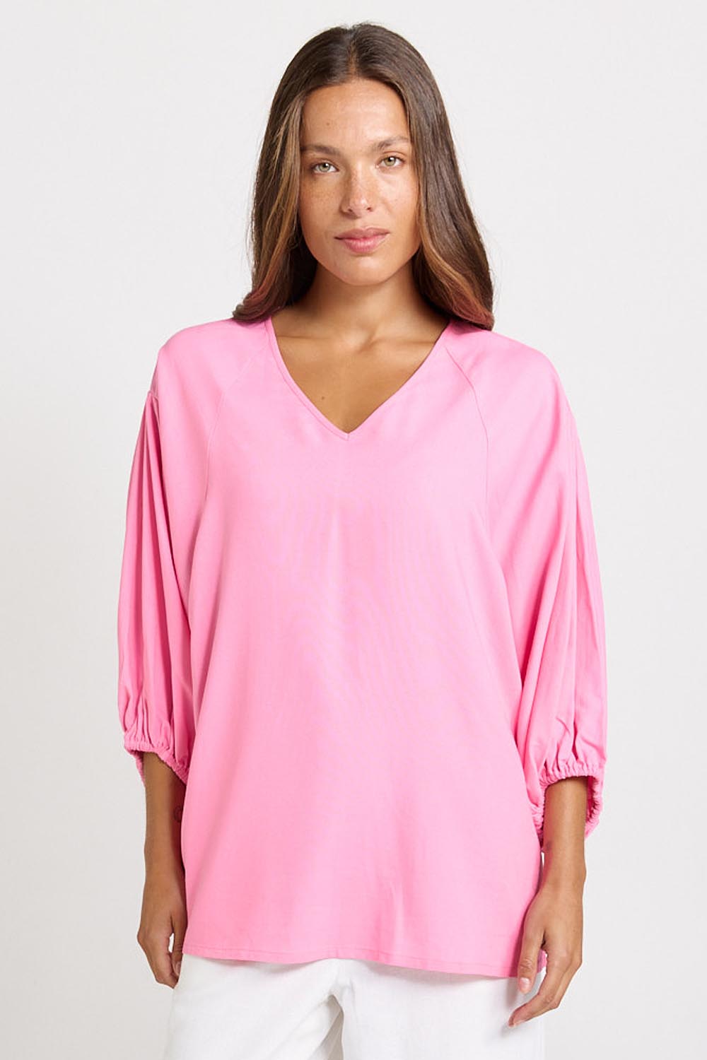 Model Genericm wearing size sample of the Bella Blouse – Pink in colour Pink, in a cropped view