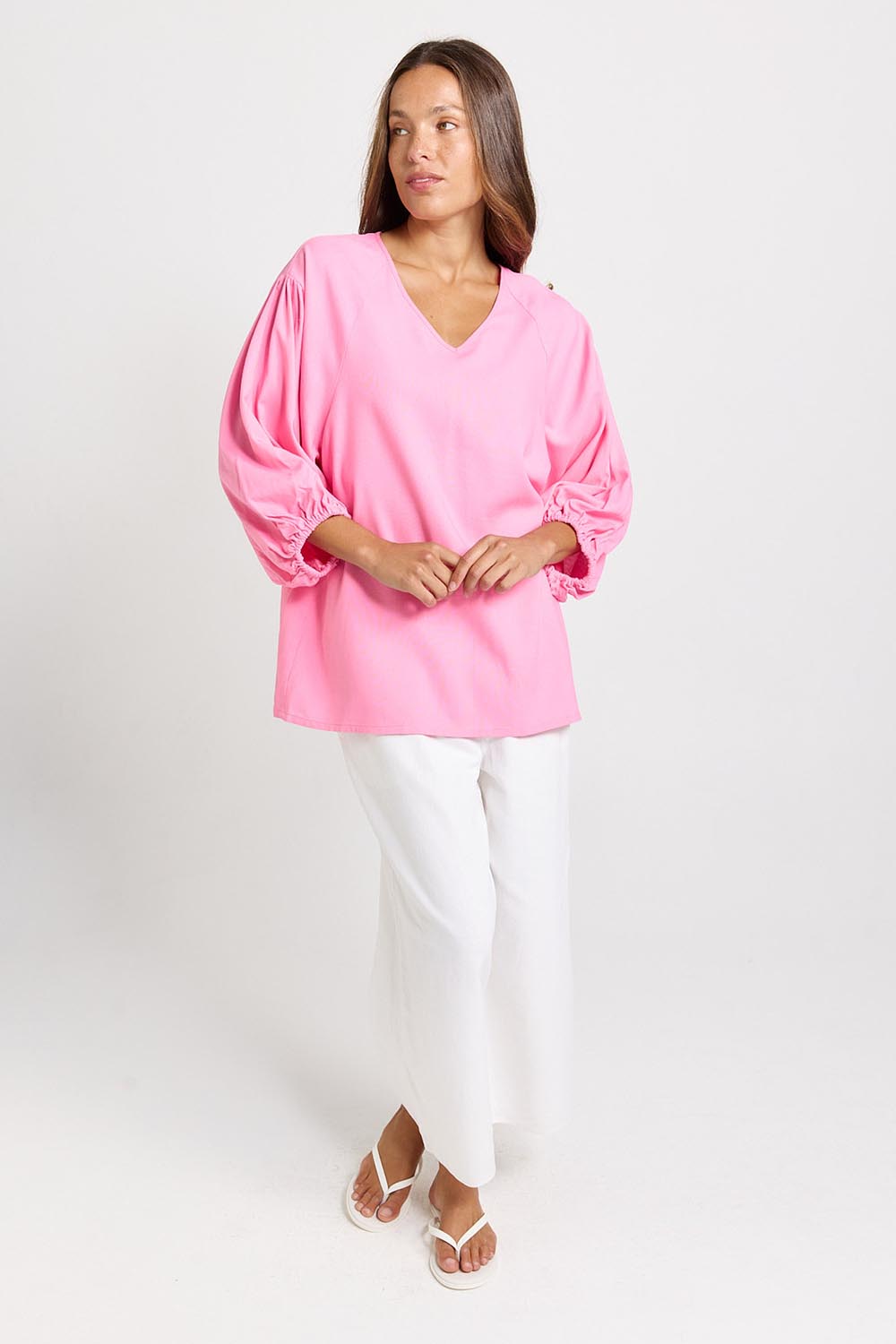 Model Genericm wearing size sample of the Bella Blouse – Pink in colour Pink, from the front