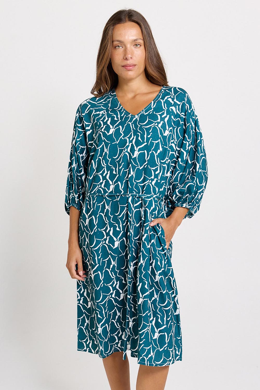 Model Genericm wearing size sample of the Bella Dress – Teal in colour Teal, from the front