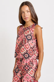 Model Genericm wearing size sample of the Coco Shell Tank – Coco in colour Coco, from an angle