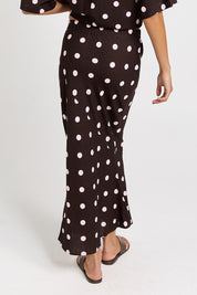 Model Genericm wearing size sample of the Sable Bias Yoke Skirt – Pinkchoc in colour Pinkchoc, from the back