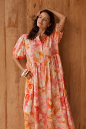Model Genericm wearing size sample of the Nia Dress – Floral in colour Floral, from an angle