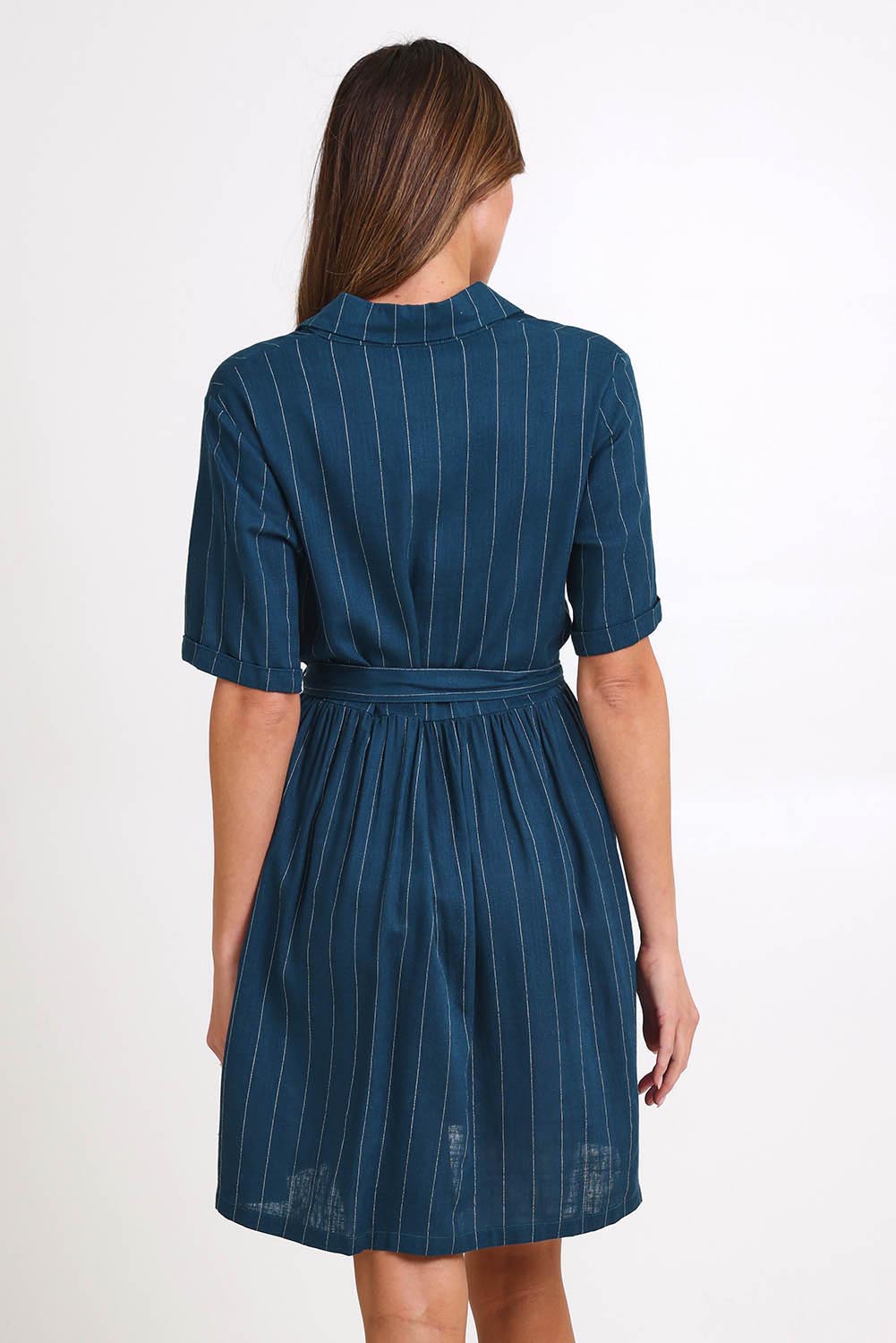 Model Madelinec wearing size 10 of the Palm Shirt Dress – Teal in colour Teal, from the back