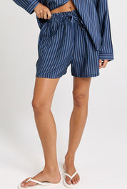 Model Genericm wearing size sample of the Sorrento Short – Blue in colour Blue, from an angle