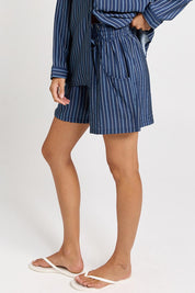 Model Genericm wearing size sample of the Sorrento Short – Blue in colour Blue, from an angle