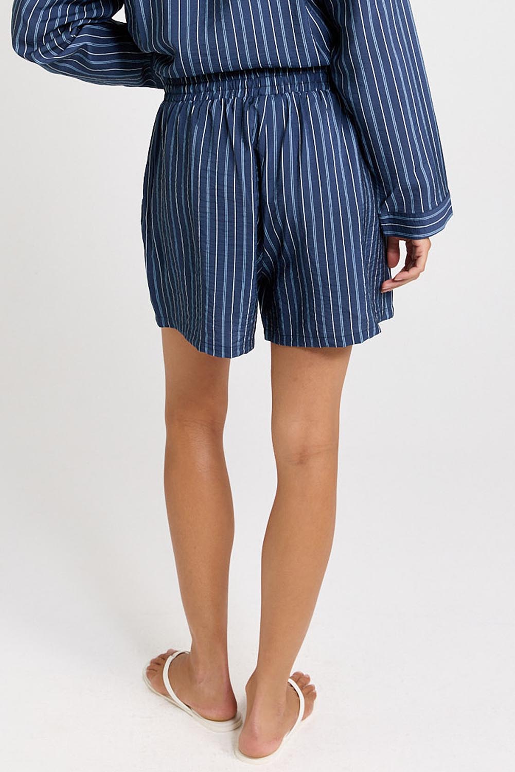 Model Genericm wearing size sample of the Sorrento Short – Blue in colour Blue, from an angle
