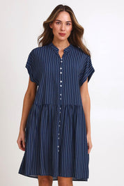 Model Madelinec wearing size 10 of the Sandy Dress – Blue in colour Blue, in a cropped view