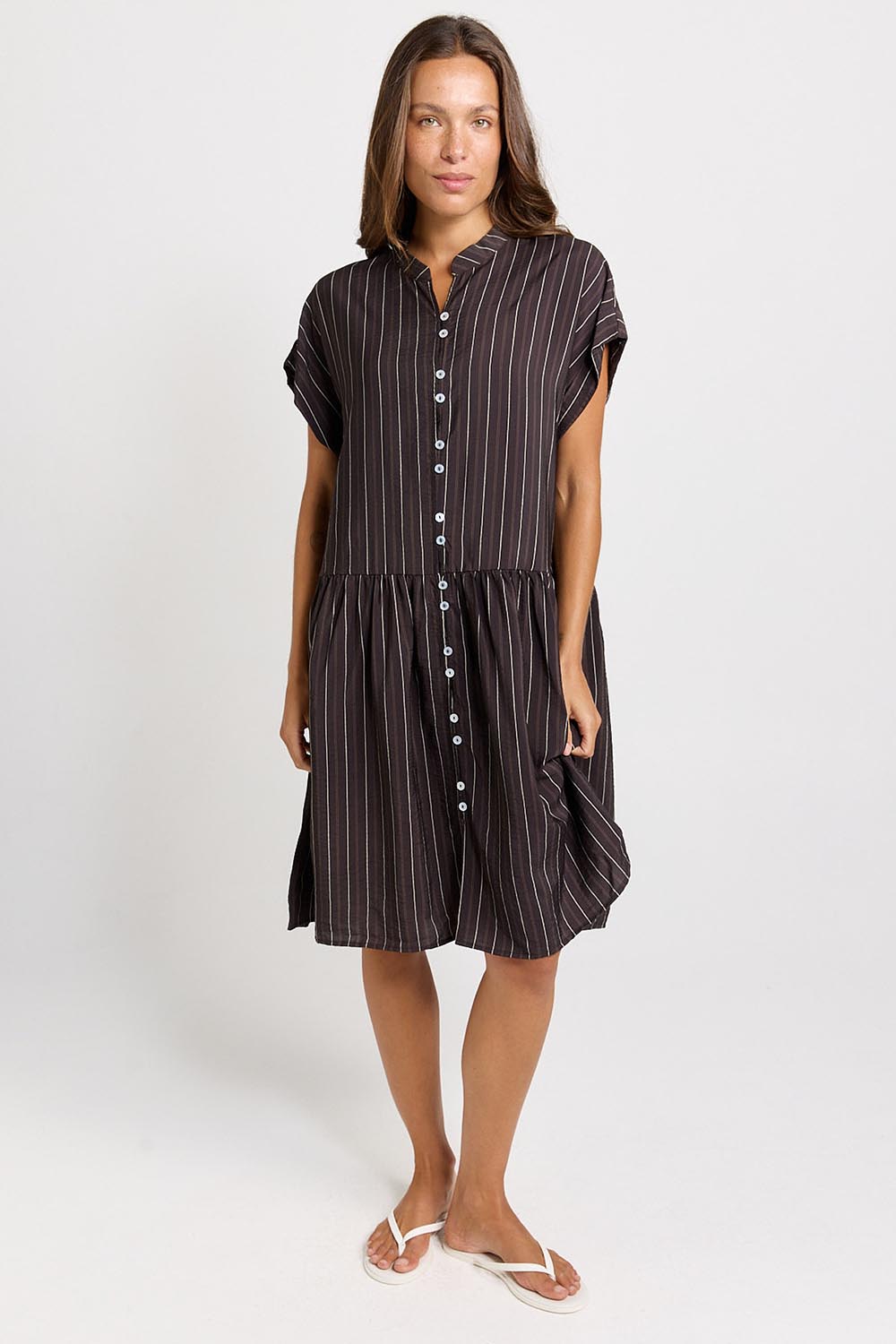 Model Genericm wearing size sample of the Sandy Dress – Brown in colour Brown, from the front