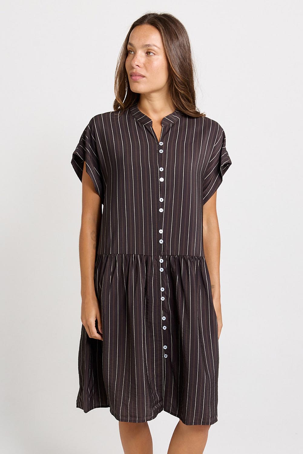 Model Genericm wearing size sample of the Sandy Dress – Brown in colour Brown, from the front