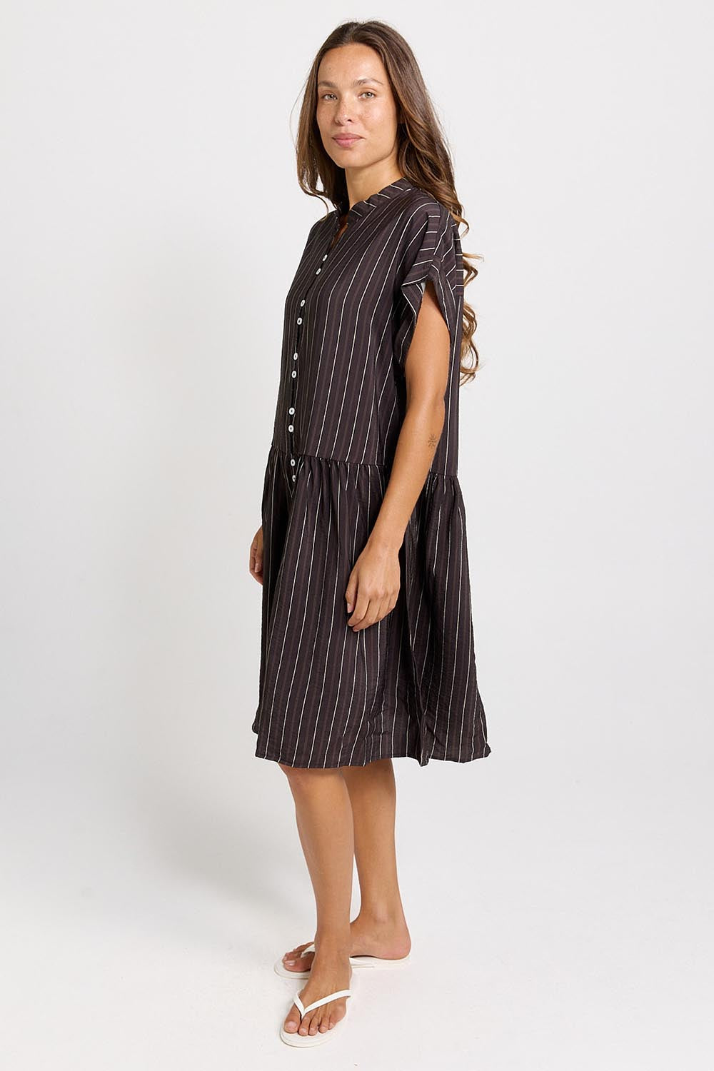 Model Genericm wearing size sample of the Sandy Dress – Brown in colour Brown, from the front