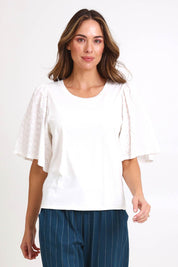 Model Madelinec wearing size 10 of the Bianca Broderie T-Shirt – White in colour White, in a cropped view