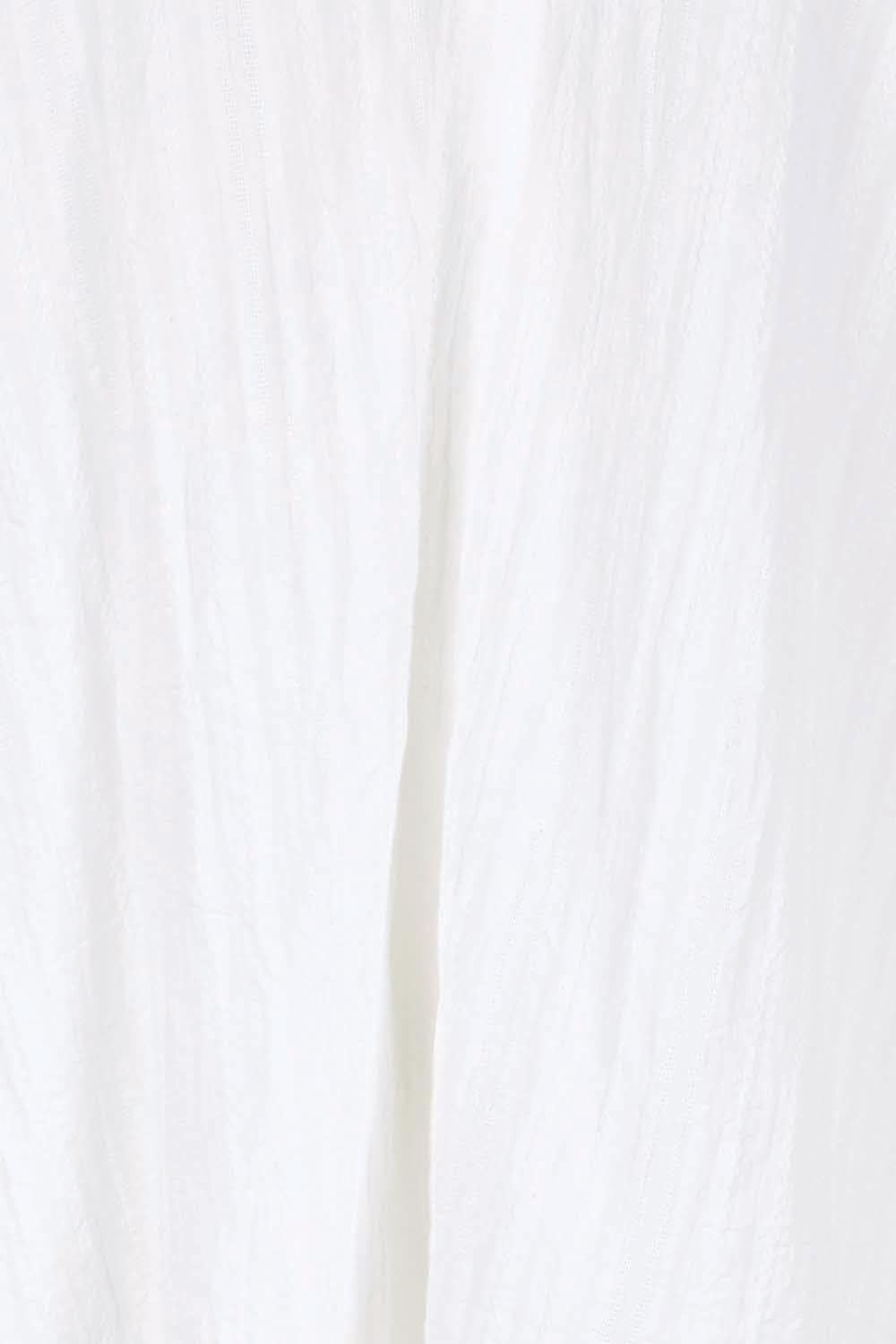 Product shot of the Daisy Broderie Blouse – White in colour White, showing detail