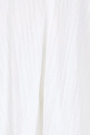 Product shot of the Daisy Broderie Blouse – White in colour White, showing detail