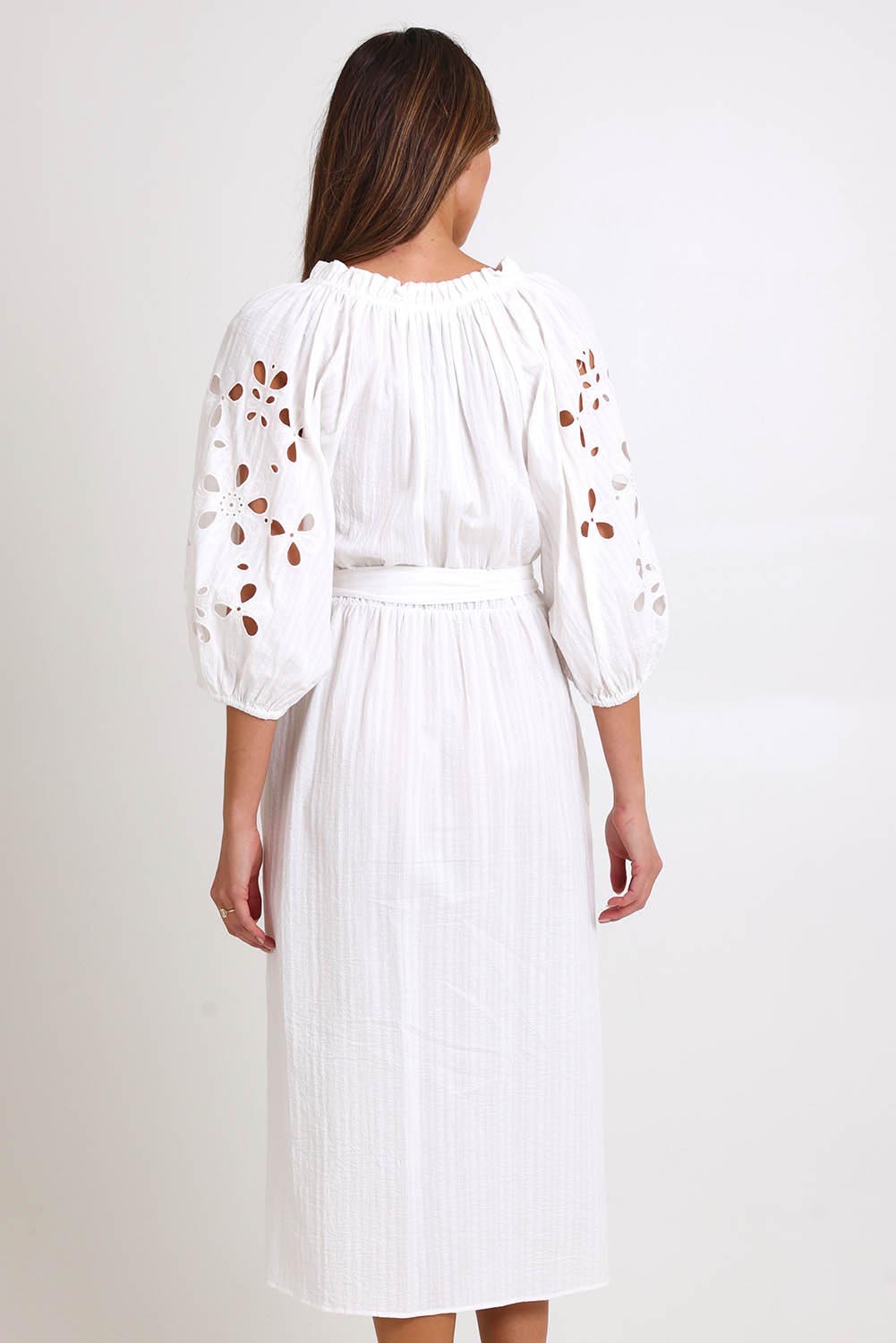 Model Madelinec wearing size 10 of the Nia Dress – White in colour White, from the back