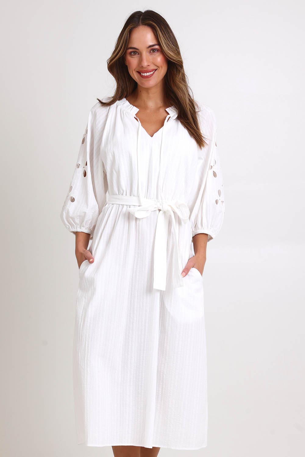 Model Madelinec wearing size 10 of the Daisy Broderie Dress - White in colour White, in a cropped view