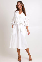 Model Madelinec wearing size 10 of the Nia Dress – White in colour White, from the front