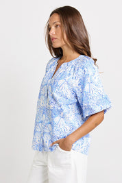 Model Genericm wearing size sample of the Bronte Blouse – Blueshell in colour Blueshell, from an angle