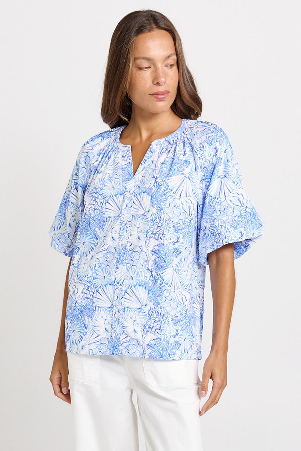 Model Genericm wearing size sample of the Bronte Blouse – Blueshell in colour Blueshell, in a cropped view