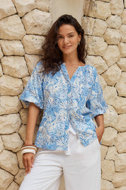 Model Genericm wearing size sample of the Bronte Blouse – Blueshell in colour Blueshell, in a cropped view