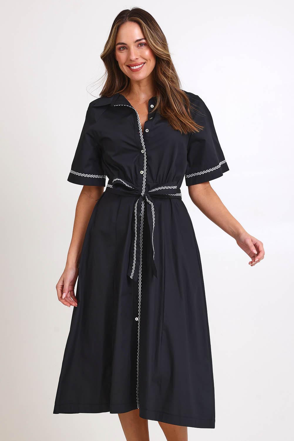 Model Madelinec wearing size 10 of the Lucy Shirt Dress – Black in colour Black, in a cropped view