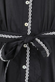 Product shot of the Lucy Shirt Dress – Black in colour Black, showing detail
