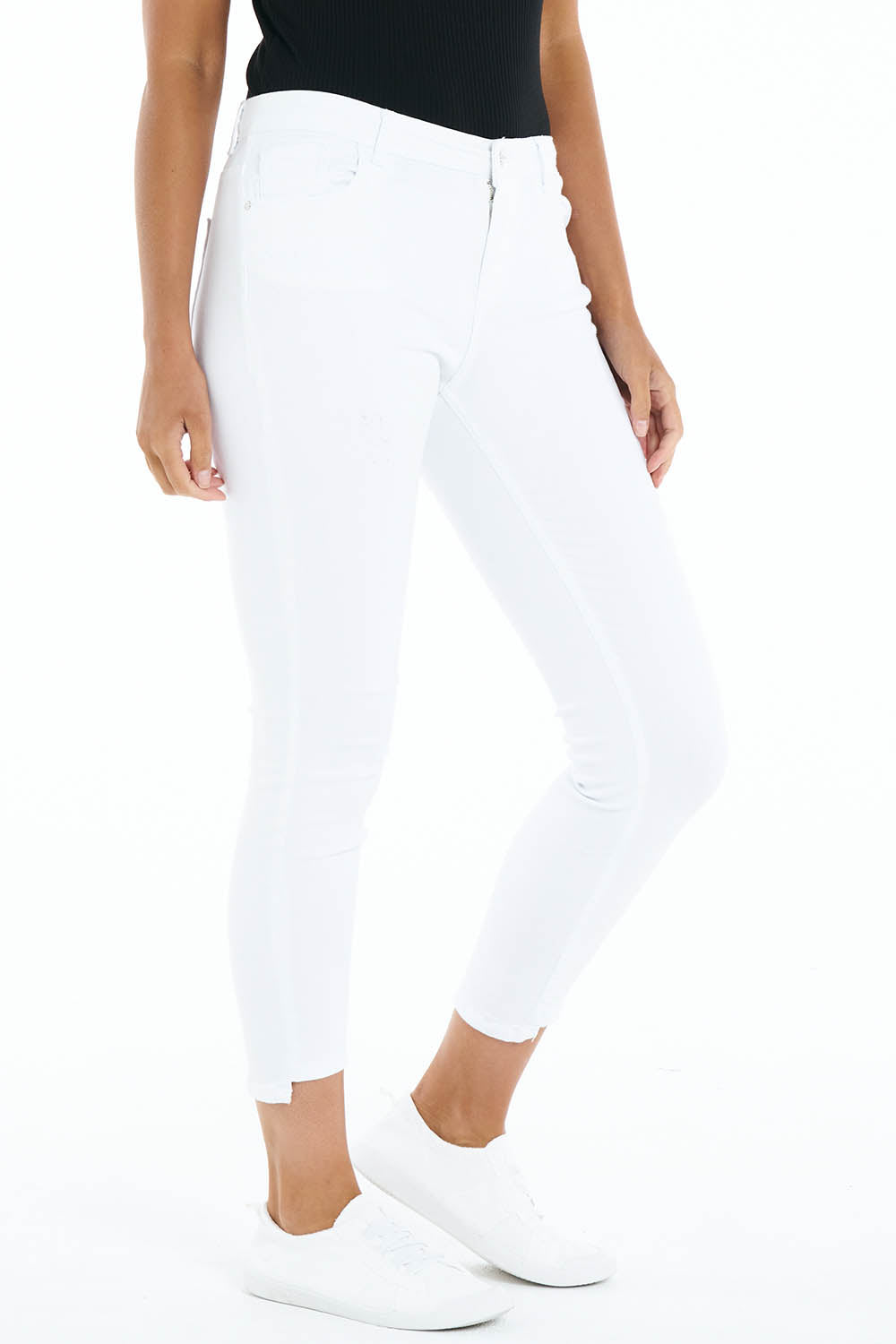 A model wearing the August Denim Jean in colour White (White), from the front, cropped image