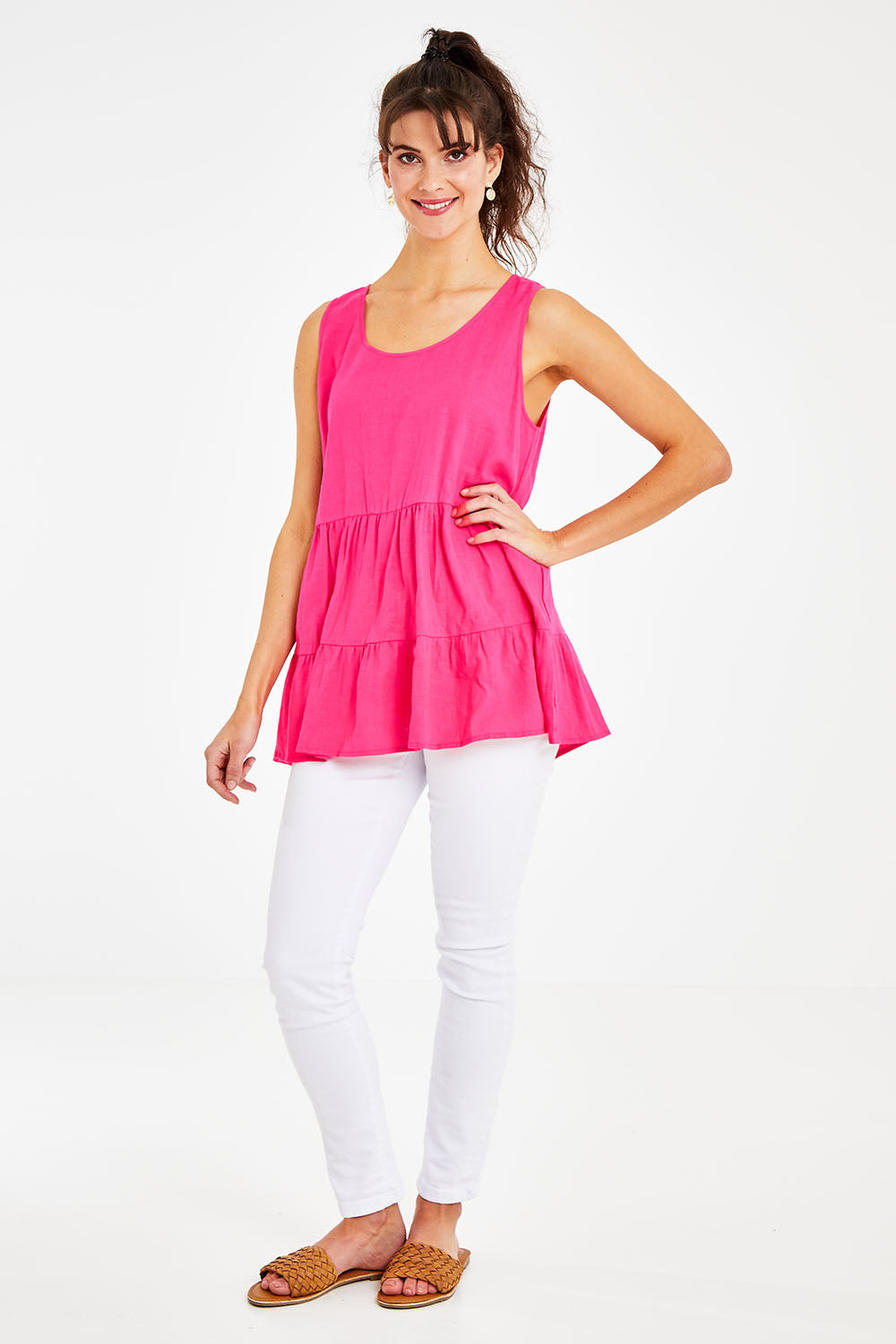 Model Courtney wearing size 10 of the Andie Top in colour Flamingo (Pink), from the front, showing the whole outfit