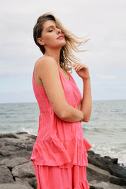 A model wearing the Andie Top in colour Flamingo (Pink), from the front, showing the whole outfit
