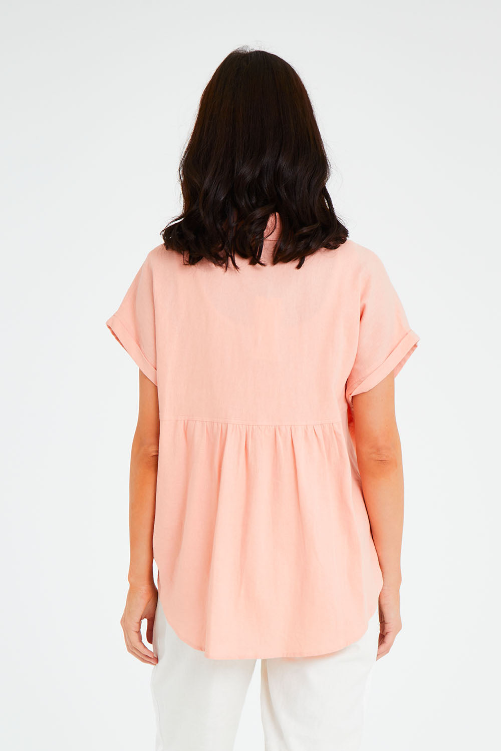 Model Andrea wearing size 10 of the Robin Shirt in colour Granita (Pink), from the back