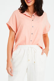 Model Andrea wearing size 10 of the Robin Shirt in colour Granita (Pink), from the front, cropped image