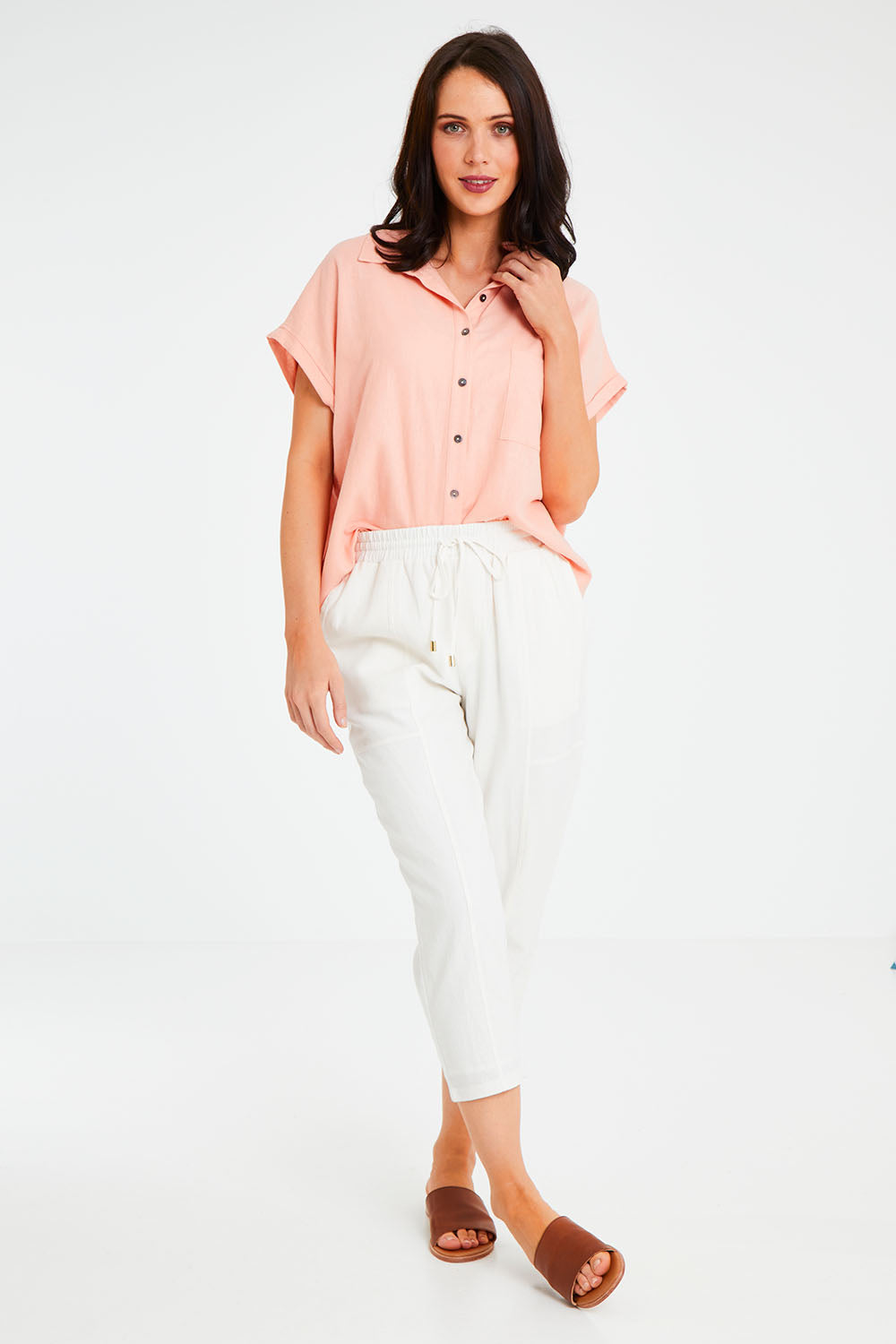 Model Andrea wearing size 10 of the Robin Shirt in colour Granita (Pink), from the front, showing the whole outfit