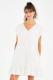 Model Courtney wearing size 10 of the Maree Dress in colour White (White), from the front, cropped image